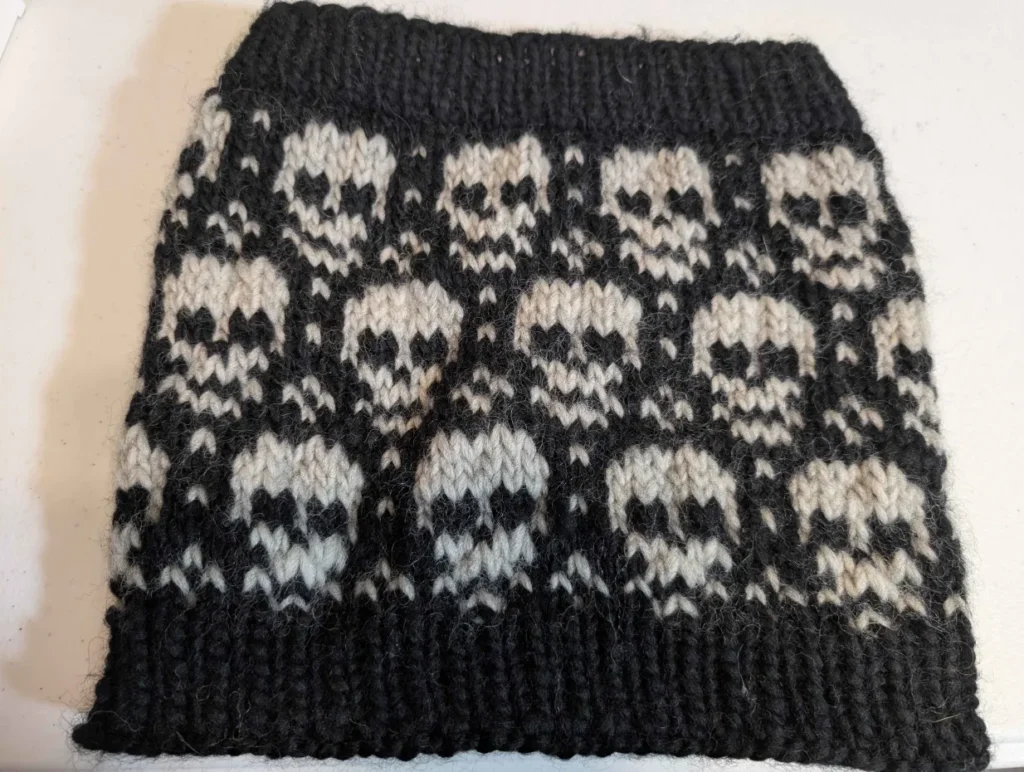 Completed skull cowl made from a scaled-up sock pattern.